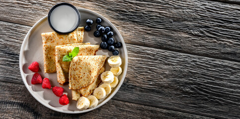 Home-made Polish pancakes filled with sweet cottage cheese