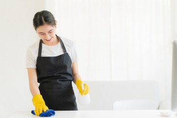 Close up view of person cleaning computer keyboard using tablecloth cleaning concept