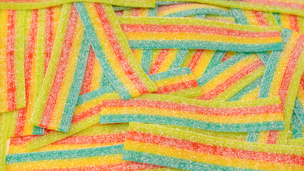 Colorful juicy gummy candies background. Top view. J