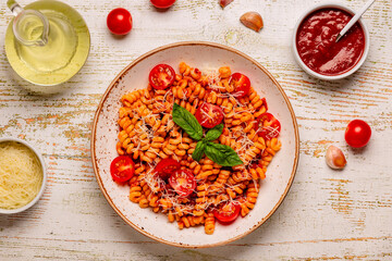 Homemade pasta with tomato sauce, top view.