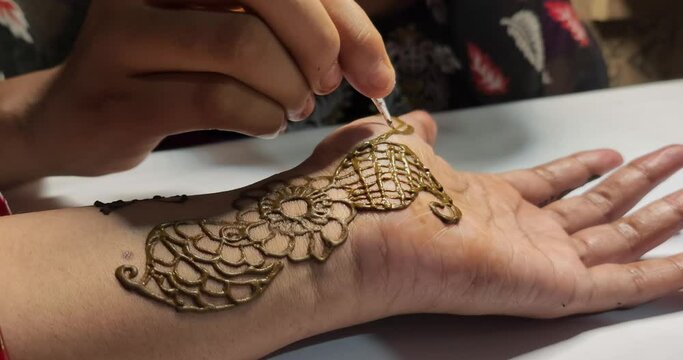 Girl Doing Henna Tattoo mehndi