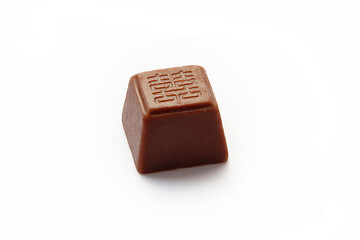 Chocolate was stamped with the auspicious Chinese sign isolated on white background. The Exclusively Special occasion dessert concept.