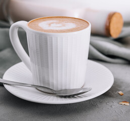 Cappuccino or latte coffee with heart shape and almonds