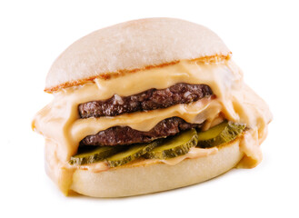 hamburger with two cutlets, pickled cucumbers and melted cheese