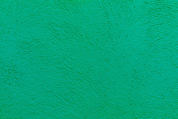 background of green painted plaster wall