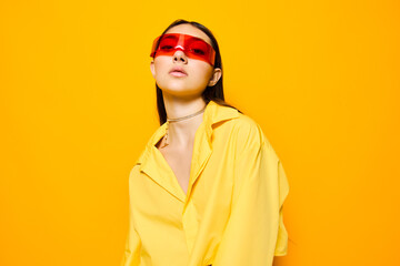 Fototapeta premium sunglasses woman joyful beautiful girl lifestyle fashion young yellow trendy attractive