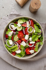 salad with fresh vegetables and cheese on the table, culinary background