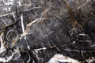 Background from a photo of a chipped dark marble with white veins and cracks