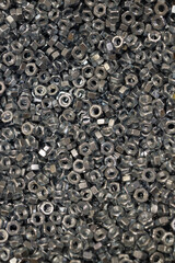 Lots of nuts for bolts and screws. Background for wallpaper, texture.