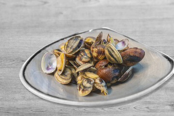 Fototapeta na wymiar Clams Sautè, in the ceramic container.