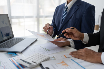 business people meeting in the office Calculate company tax and investment income Strategic planning and colleague brainstorming. Reports. Analyze charts. team work concept.