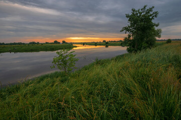 Fototapeta premium sunset over the river