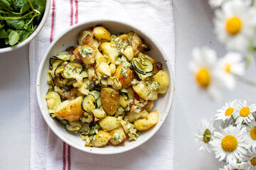 Roast potato and zucchini salad with capers and garlic dressing