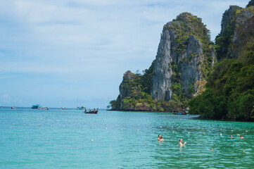 Phi Phi Island with long tail boat and white sand beach