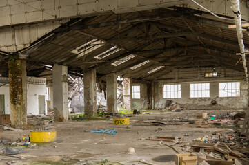 Large abandoned industrial hall or storage space