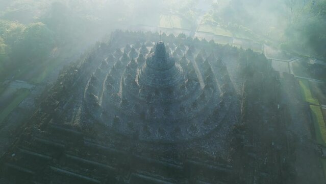 Borobudur temple on the background of sunrise and fog. Aerial view. Java, Indonesia