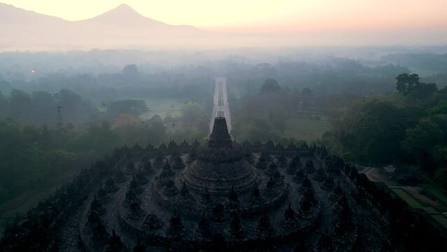 Borobudur temple on the background of sunrise and fog. Aerial view. Java, Indonesia