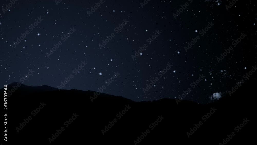 Wall mural a movement of stars in the night sky with the view of mountains