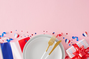 Bastille Day-inspired table styling. Top-down view of plates, cutlery, national flag, gift box,...