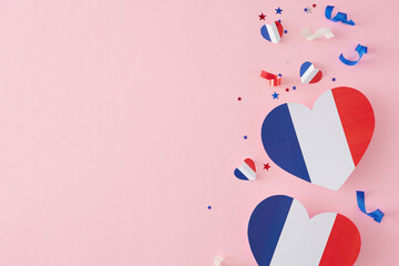 French National Day gala concept. Top view flat lay of french paper hearts, star-shaped confetti on...