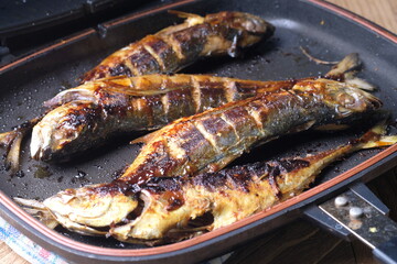 Teflon grilled skipjack. fish baked in a teflon-coated pan. Ikan cakalang bakar. Indonesian food. 
