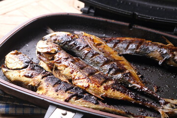 Teflon grilled skipjack. fish baked in a teflon-coated pan. Ikan cakalang bakar. Indonesian food. 
