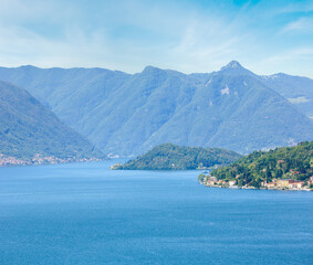Alpine Lake Como summer  misty view from mountain top (Italy)
