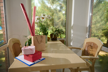 Small business. Flower shop interior. Floral design studio, decorations and arrangements and gifts. Flowers delivery service and sale of houseplants in pots, wooden showcase, nobody.