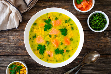 Chowder - american style fish soup on wooden table
