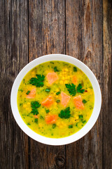 Chowder - american style fish soup on wooden table
