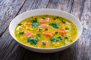 Chowder - american style fish soup on wooden table
