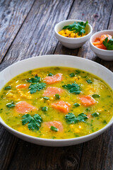 Chowder - american style fish soup on wooden table
