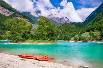 Foto op Plexiglas Amazing beautiful turquoise lake Tenno in Trentino region of Italy, surrouded by Alps mountains.  panoramic view with tiny island and canoe © Freesurf