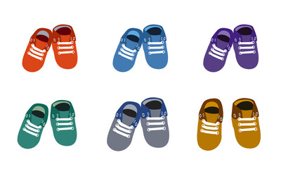 Colorful baby slippers on a colorless background