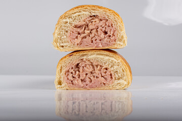 Ham pieces. Sweet bread stuffed with ham. Traditional Venezuelan snack. Bakery food. Breakfast
