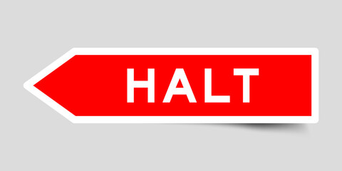 Red color arrow shape sticker label with word halt on gray background