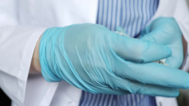 doctor hides in his pocket a bribe cash money dollars, corruption in medicine, medical financial crimes