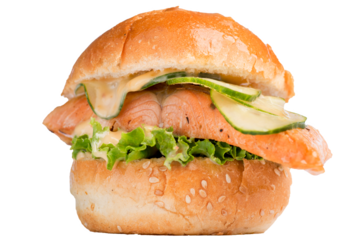 Fish burger with a piece of salmon and fresh cucumbers. Tall burger with sauces