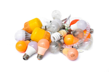 Pile of garbage Used and disposed of light incandescent bulb and energy saving lamps (LED) expired...