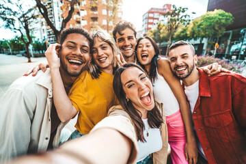 Multicultural friends taking selfie pic with cellphone outside - Happy young people having fun hanging out on city street - Summer vacation concept with guys and girls enjoying summertime holiday - obrazy, fototapety, plakaty