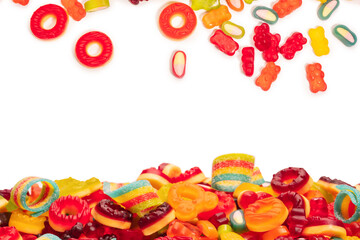 Obraz na płótnie Canvas Assorted colorful gummy candies. Top view. Jelly donuts. Jelly bears. Isolated on a white background.