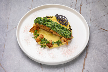 A delicious fish dish from a restaurant. Close up