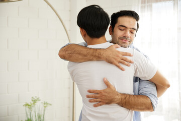 LGBT gay couple hugging each other in the room