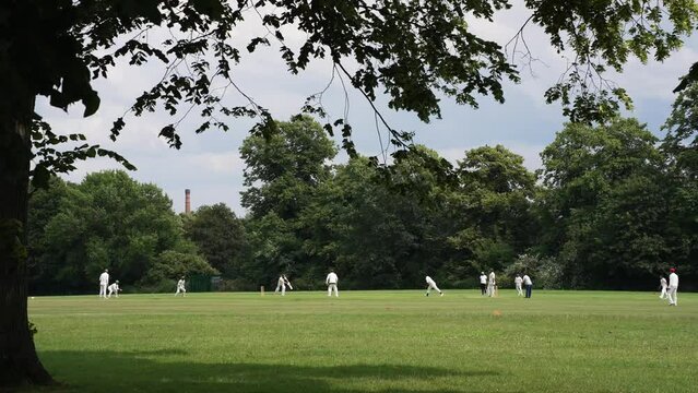 English Park Cricket.
Long shot of a cricket game being played at Calthorpe Park in Birmingham, England.