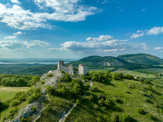 Aerial panoramic view of Sirotčí hrádek or Waisenstein ruined Gothic castle above Klentnice in...