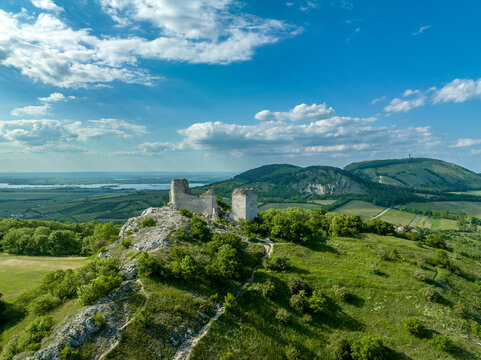 Aerial panoramic view of Sirotčí hrádek or Waisenstein ruined Gothic castle above Klentnice in South Moravia standing on two limestone cliffs 