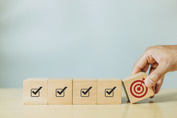 Hand hold wooden cube with icon target for a successful target. Concept of business success growth increase up