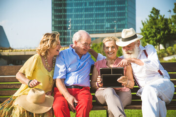 Group of senior people bonding outdoors - Happy olpd people having fun in a park, concepts about...