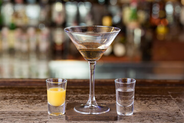Exotic cocktail with fire in a nightclub on the bar.