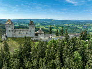 Fototapeta na wymiar Aerial view of Kasperk Hrad or Karlsberg castle in Czechia. The central part of the castle consists of two residential towers and an oblong palace which was built between them
